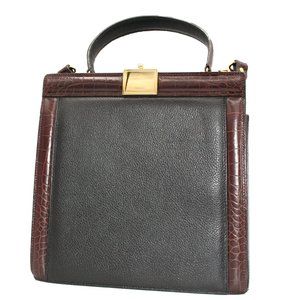 Genuine leather Bally handbag with shoulder strap and clasp closure.